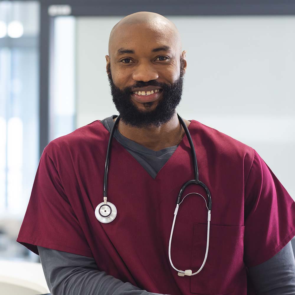 portrait of happy african american male doctor wea 587D7KQ